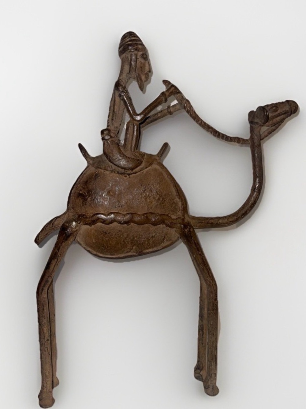 Dogon bronze statue of a camel rider from Mali. Tribal African art.